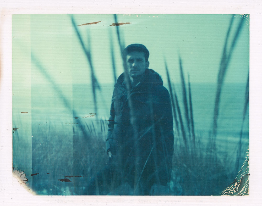 Expired film Polaroid portrait of Nathanael at Lake Michigan