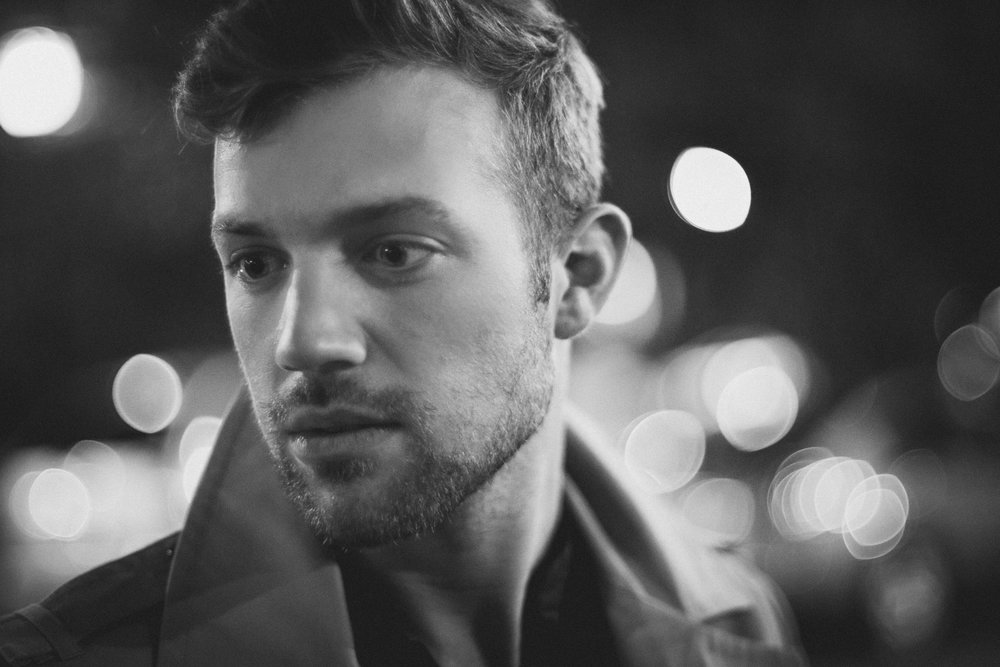 Swirling bokeh portrait of John in Logan Square